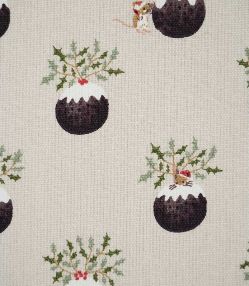 Close-up of Christmas Pudding Neutral Christmas fabric showing illustrated dark brown puddings topped with white icing, holly sprigs, red berries and festive mice.