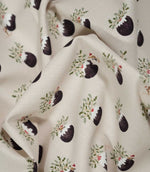 Draped Christmas Pudding Neutral fabric showing its soft woven texture and repeating Christmas pudding, holly and playful festive mouse pattern.