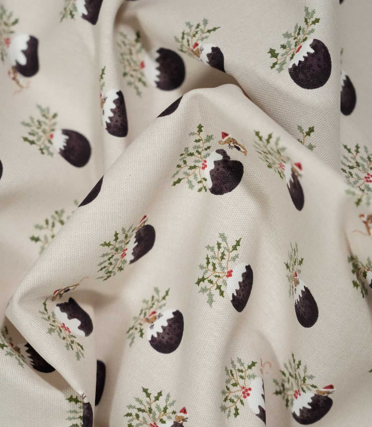 Draped Christmas Pudding Neutral fabric showing its soft woven texture and repeating Christmas pudding, holly and playful festive mouse pattern.