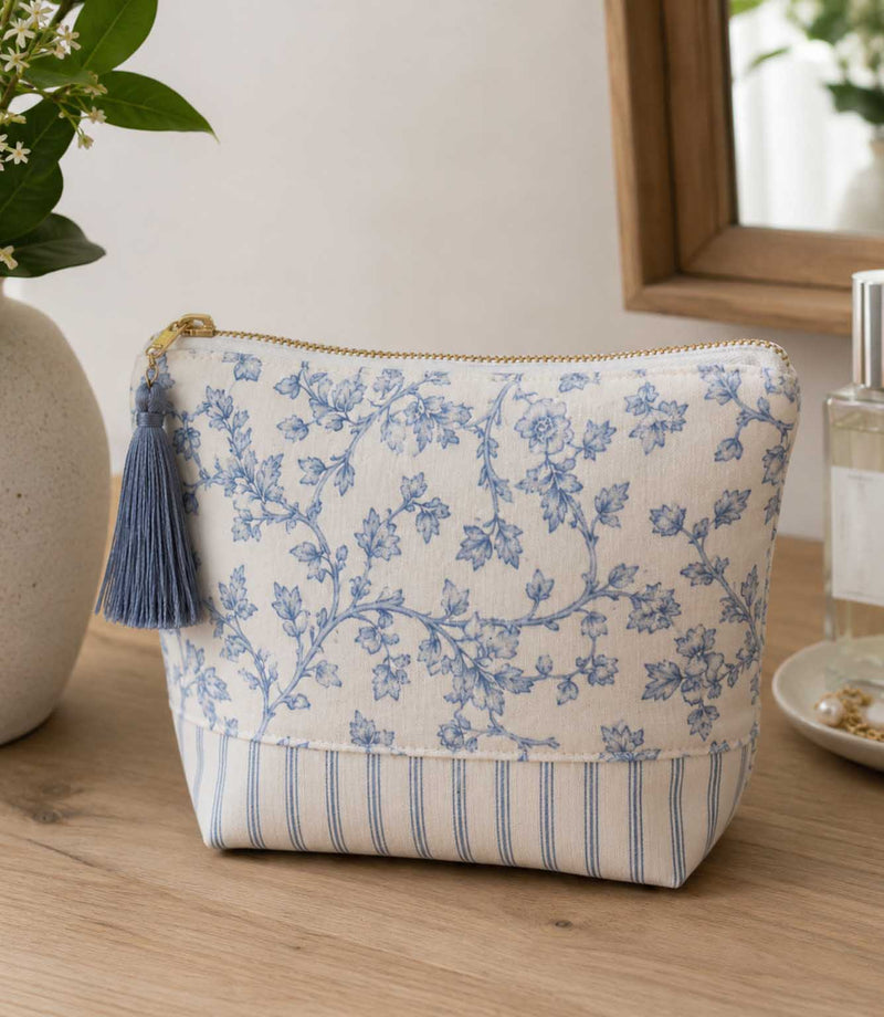 Blue ditsy floral and stripe fabric  makeup pouch with tassel