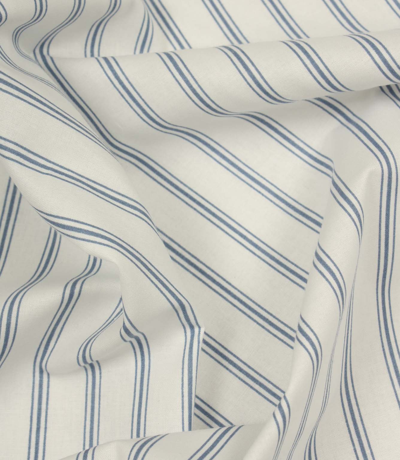 Draped striped fabric with soft blue vertical lines flowing across a natural ivory background.