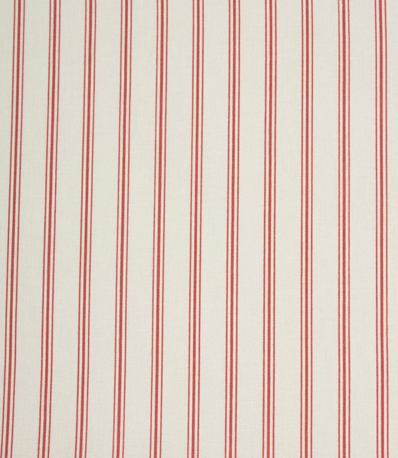 Red ticking stripe fabric with fine vertical stripes on a soft ivory background, creating a classic country-style design.