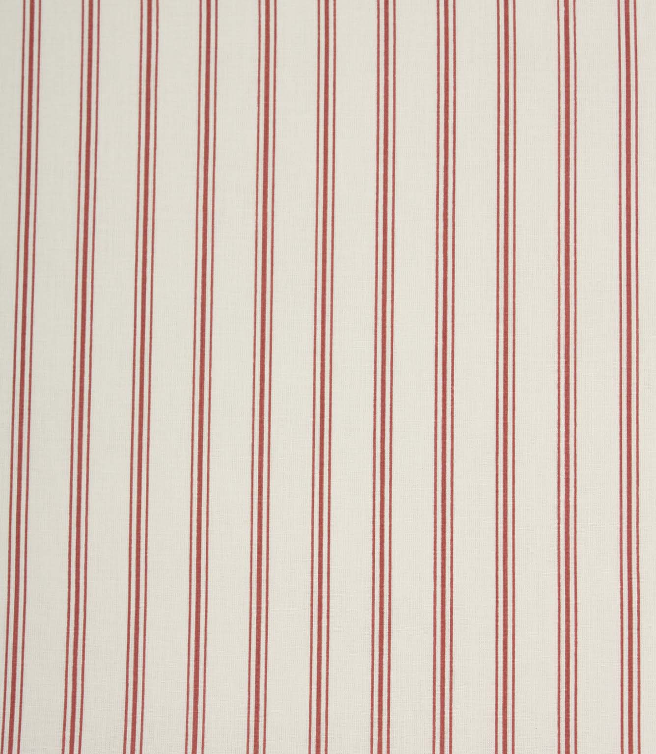 Red ticking stripe fabric with fine vertical stripes on a soft ivory background, creating a classic country-style design.