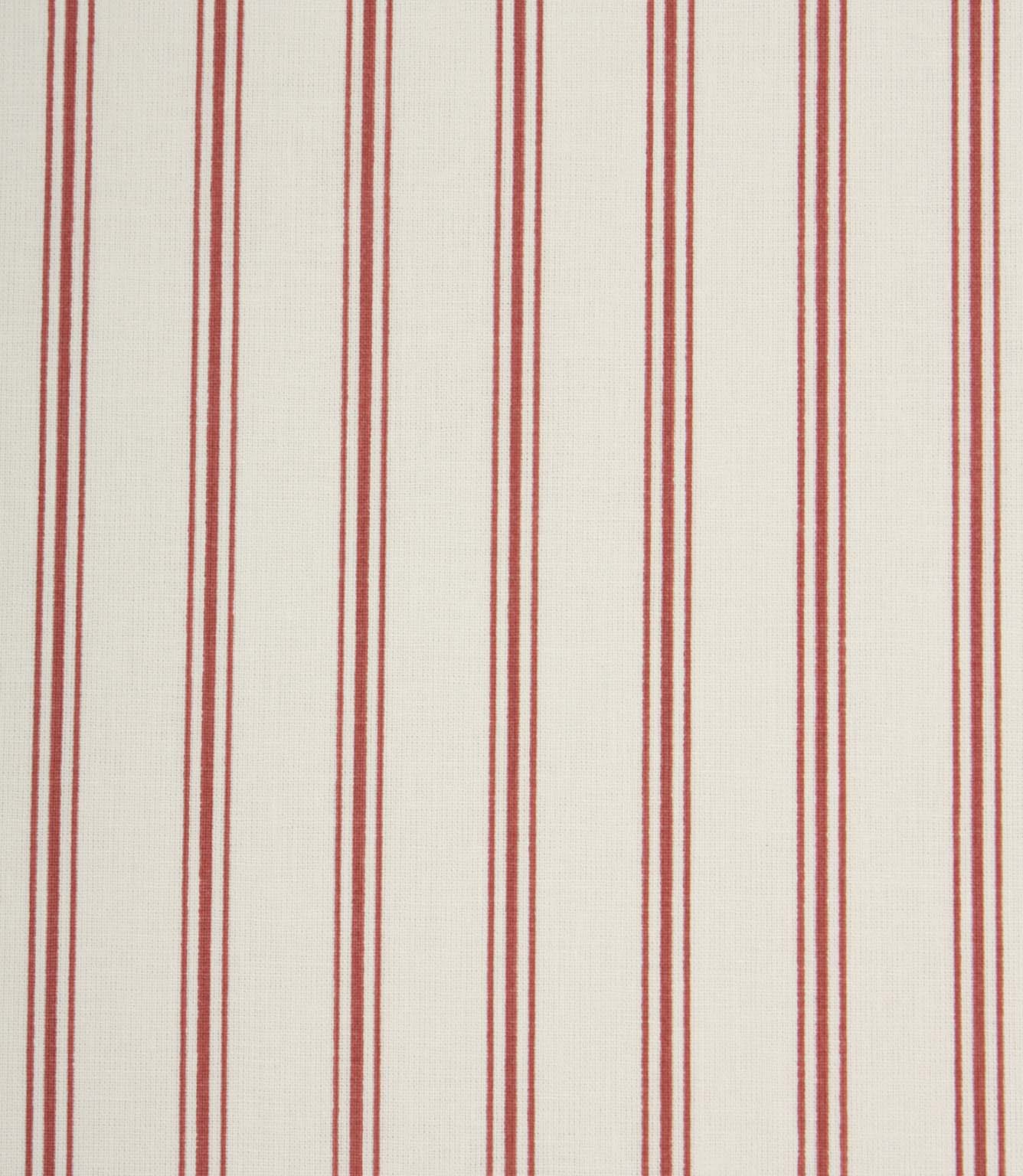 Close-up of ivory and red striped fabric showcasing the subtle woven texture and traditional ticking stripe pattern.