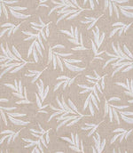 Close-up of floral embroidered fabric showing delicate leaf motifs stitched across a textured neutral base.