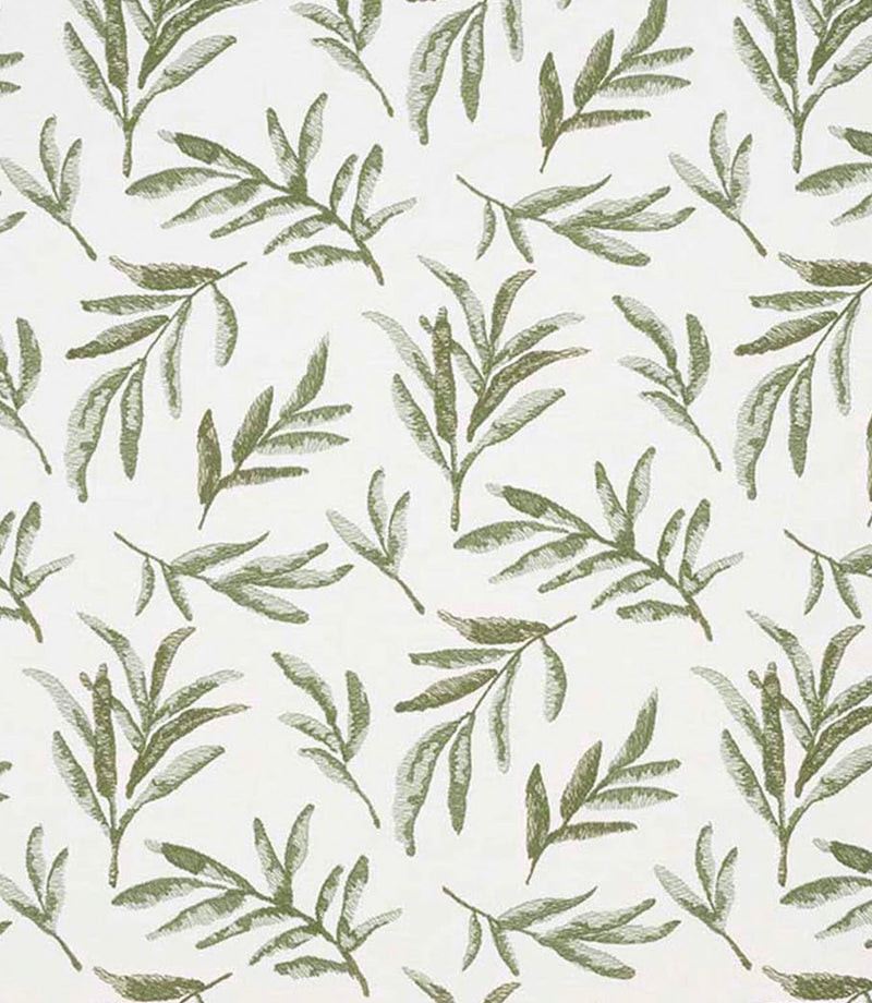 Close-up of embroidered floral upholstery fabric showing textured leaf motifs in layered olive green tones on a neutral base.