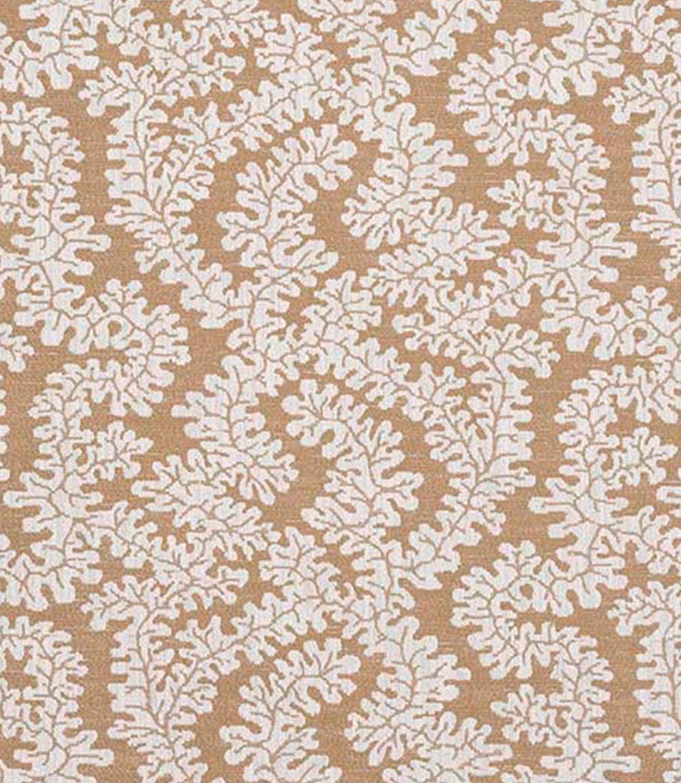 Close-up of woven foliage fabric with a soft leaf pattern in warm caramel brown and off-white tones, showing a natural textured finish.