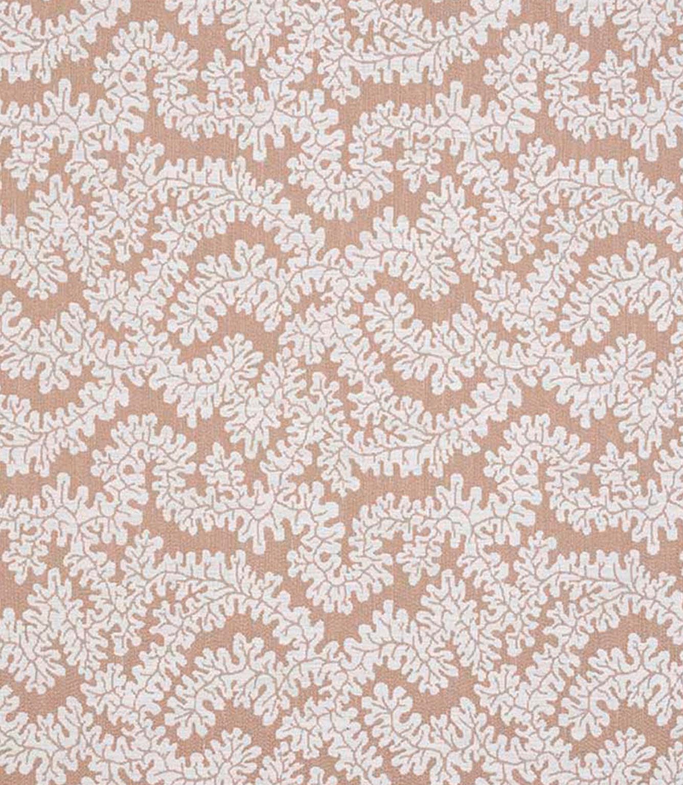 Close-up of woven foliage fabric featuring an intricate leaf pattern in warm terracotta and soft cream tones with a natural textured finish.