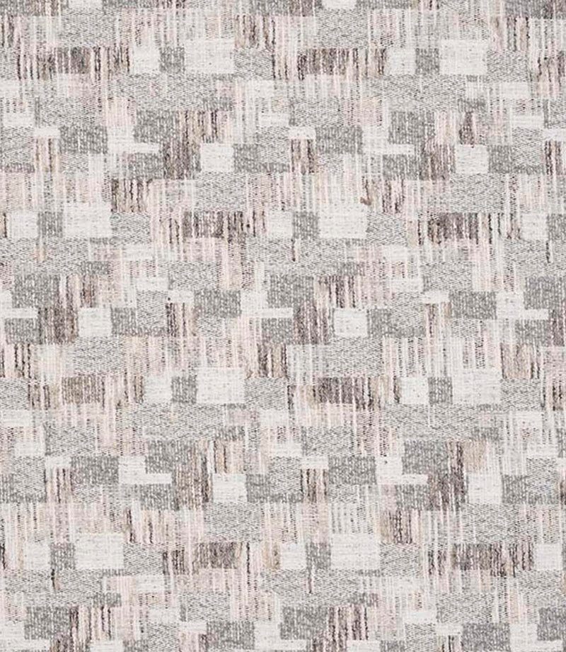 Close-up of woven geometric fabric with an abstract check pattern in soft grey, beige and off-white tones, featuring a textured, layered weave.