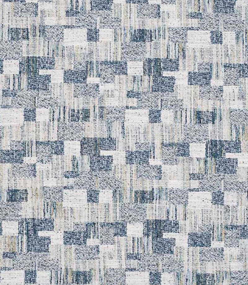 Close-up of woven geometric fabric with an abstract check pattern in soft blue, grey and off-white tones, featuring a textured, layered weave.