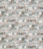 Close-up of woven geometric fabric with an abstract check pattern in soft sage green, muted blue and warm neutral tones, showing a textured, layered weave.