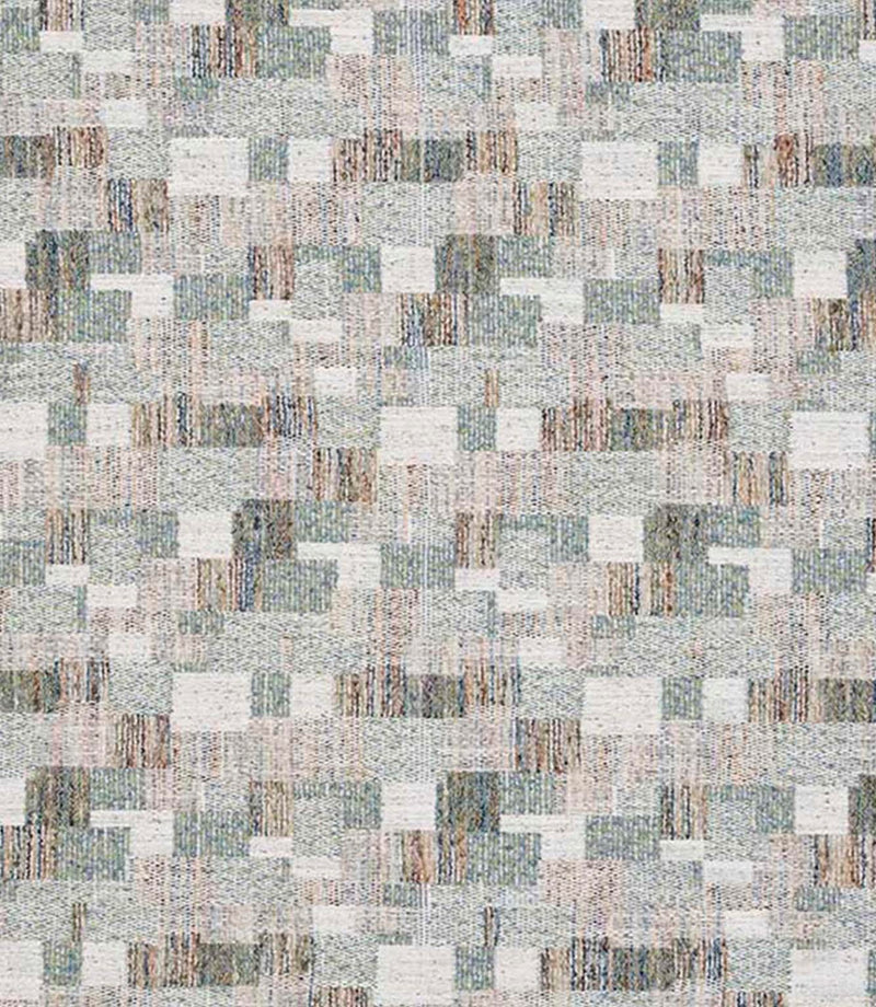 Close-up of woven geometric fabric with an abstract check pattern in soft sage green, muted blue and warm neutral tones, showing a textured, layered weave.