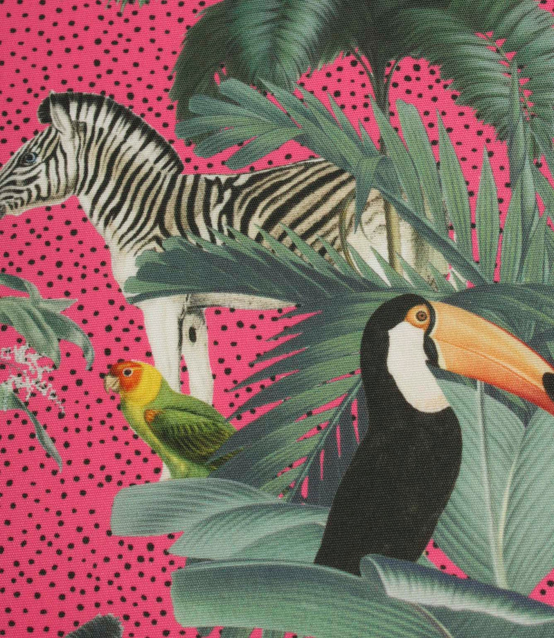 Detailed jungle print fabric with a zebra, toucan and tropical foliage set against a bright pink dotted backdrop.
