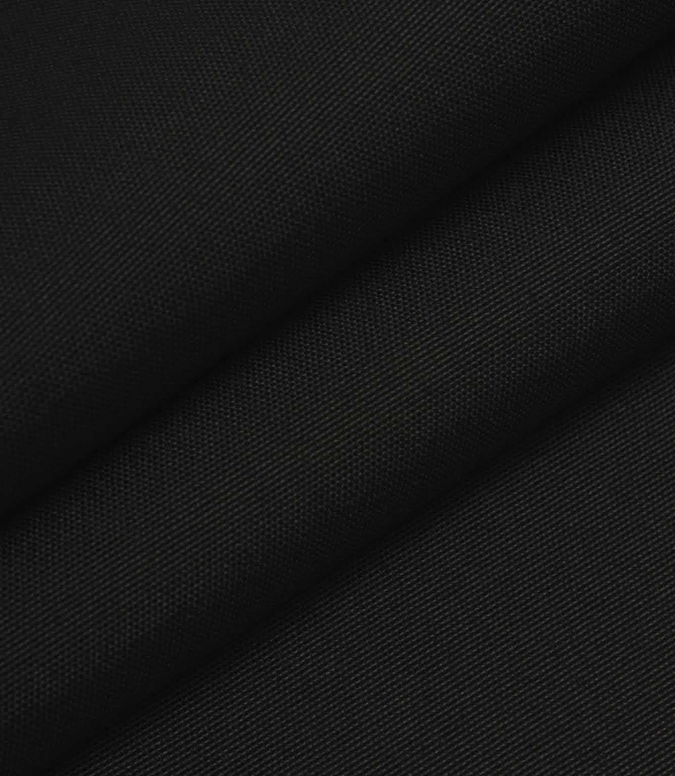 Black woven fabric folded to show structure, weight, and smooth surface finish.
