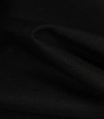 Black fabric draped to highlight texture, flexibility, and a soft, structured finish.