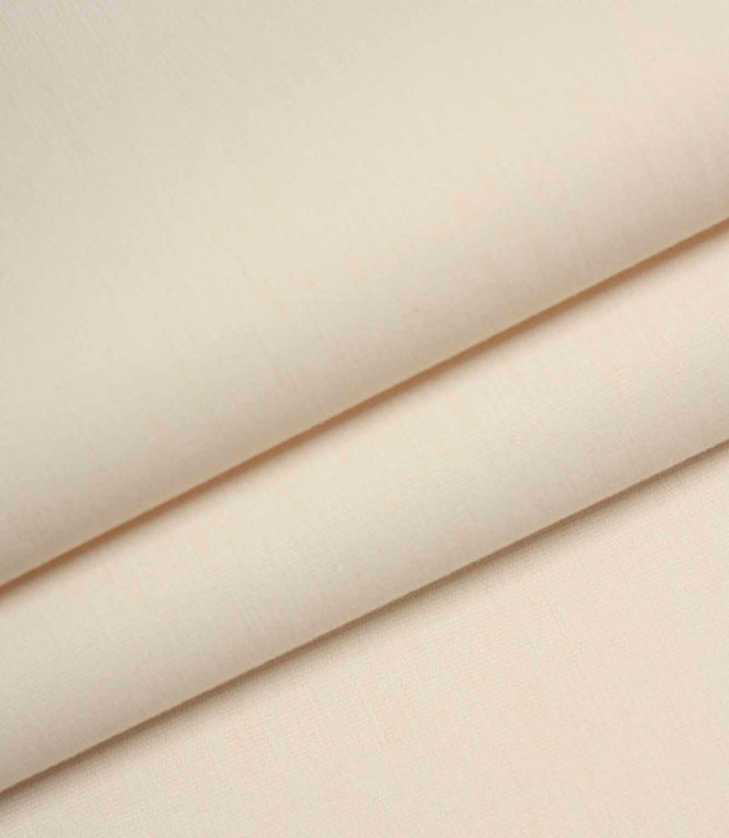 Ivory woven fabric folded to show structure, thickness, and smooth surface finish.