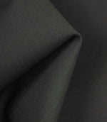 Charcoal grey fabric draped to show body, durability, and gentle surface texture in the light.