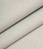 Light grey woven fabric folded to show structure, thickness, and linen-style texture.