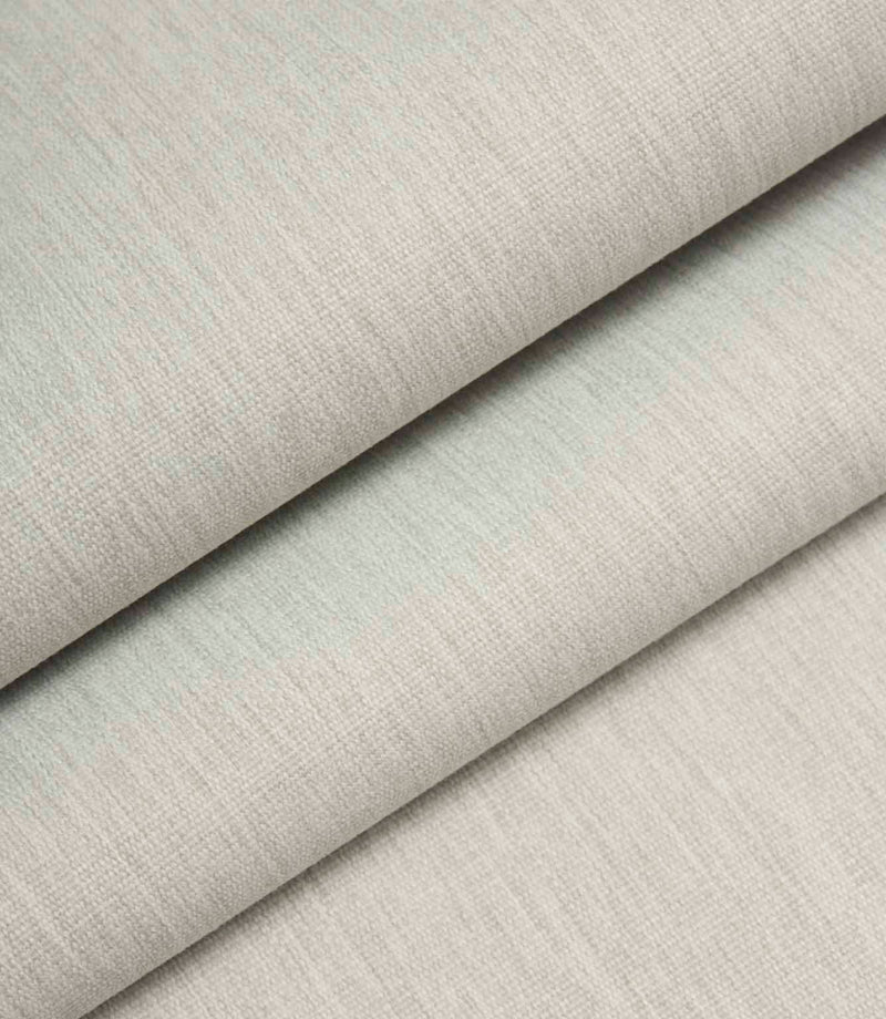 Light grey woven fabric folded to show structure, thickness, and linen-style texture.