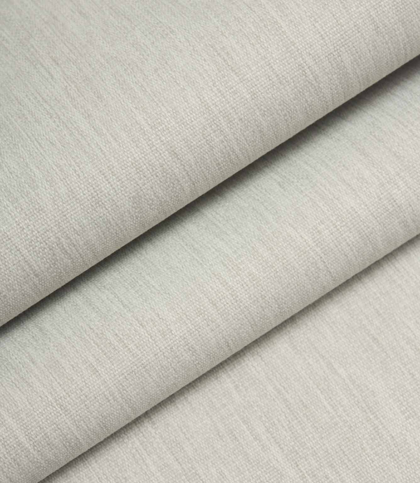 Light grey woven fabric folded to show structure, thickness, and linen-style texture.