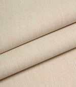 Beige woven fabric folded to show structure, weight, and linen-style texture.