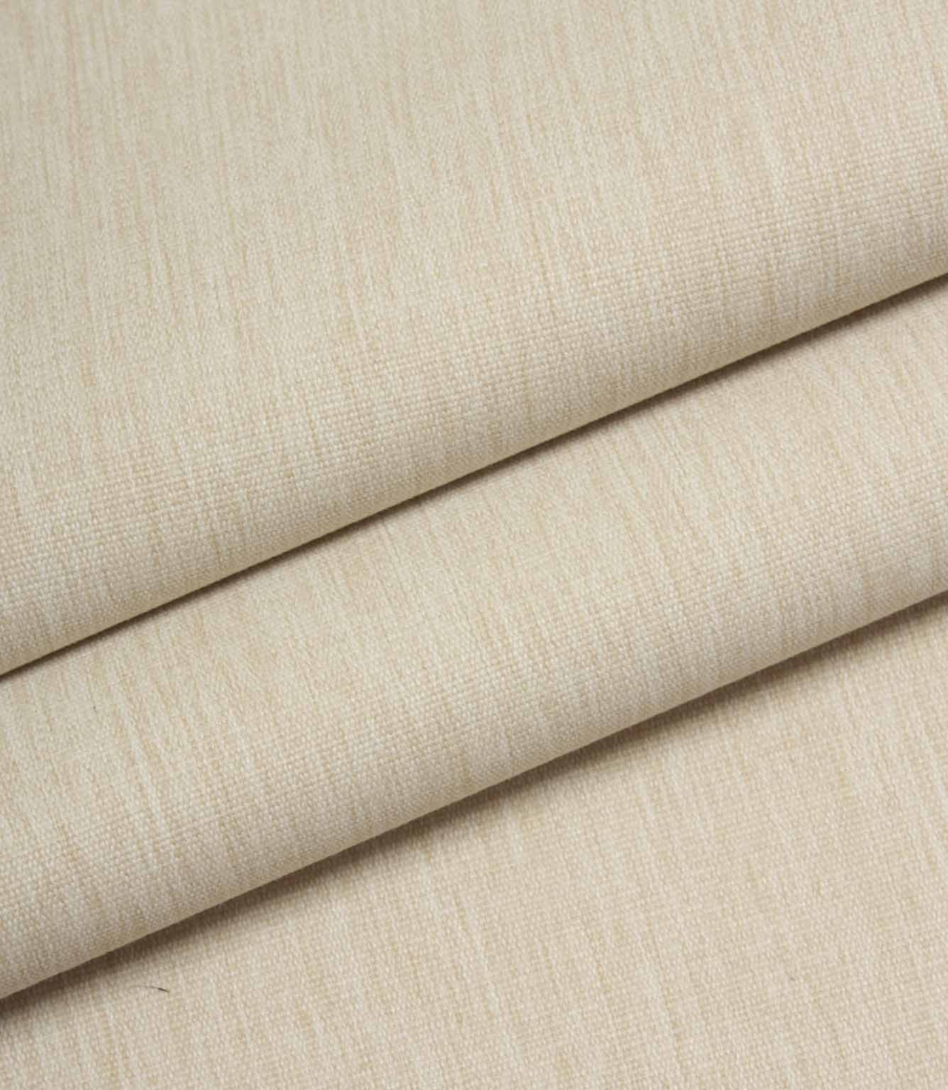 Beige woven fabric folded to show structure, weight, and linen-style texture.
