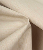 Soft beige fabric draped to highlight movement, texture, and a relaxed, natural finish.
