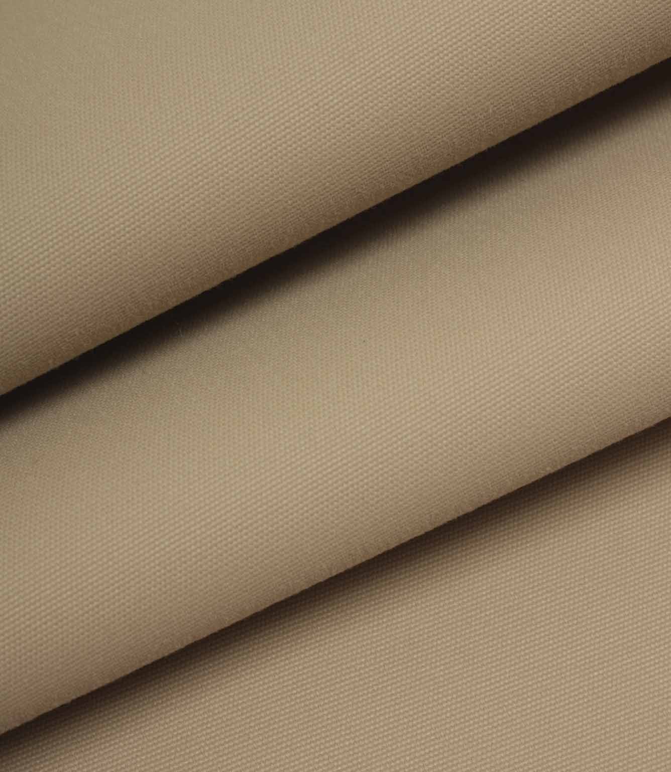 Beige woven fabric folded to show structure, weight, and smooth surface.
