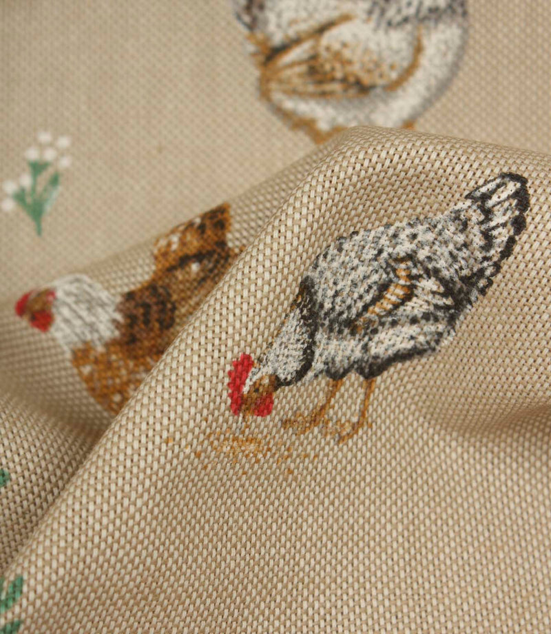 Close-up textured fabric featuring black and white hens with red comb details on a soft natural beige woven background.
