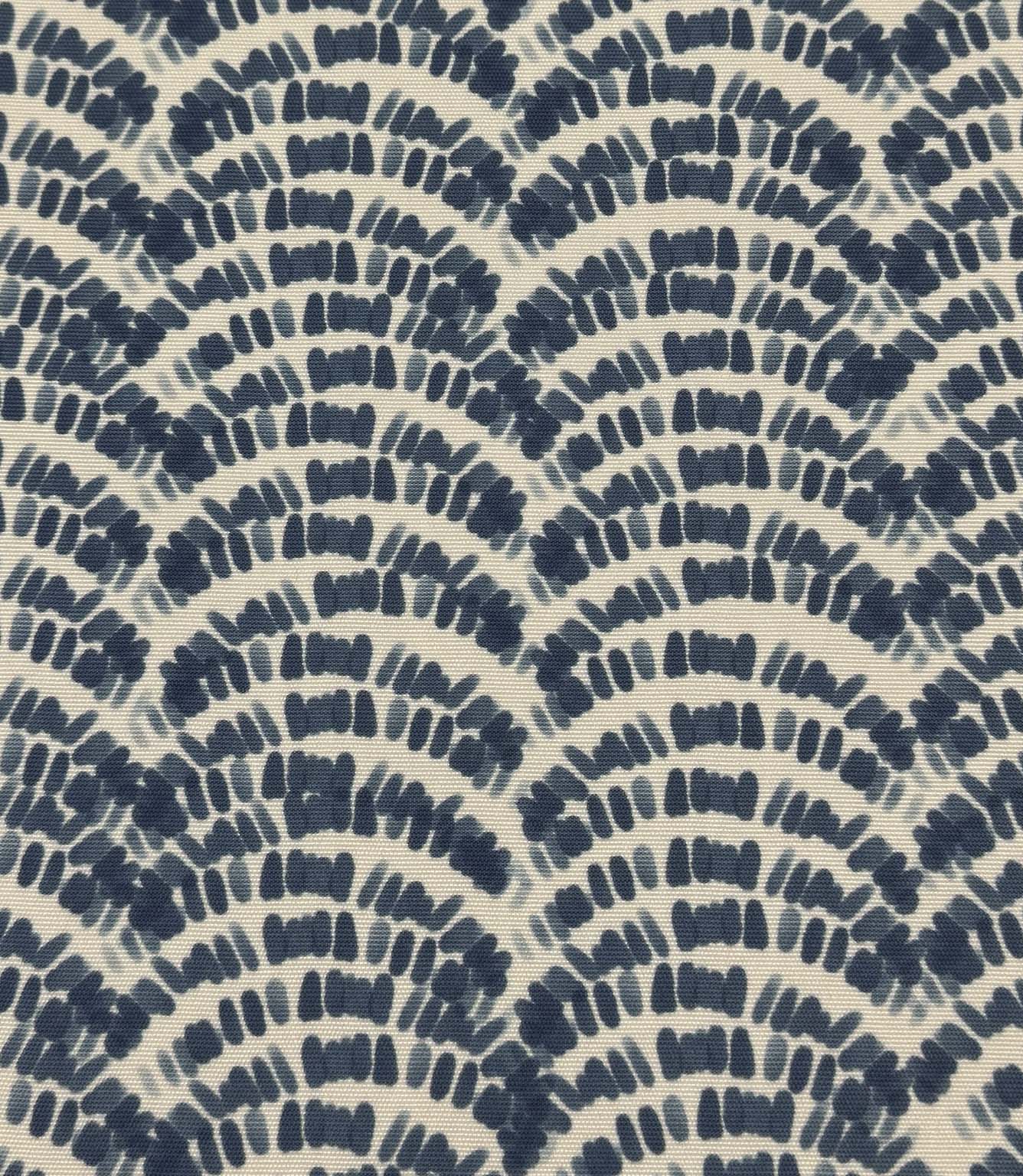 Outdoor upholstery fabric featuring layered navy and denim blue botanical wave motifs on a cream base.