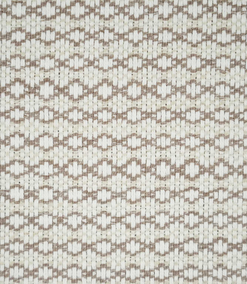 Close-up of Elkstone Taupe fabric featuring a textured natural cream weave with repeating taupe geometric motifs arranged in narrow horizontal rows.