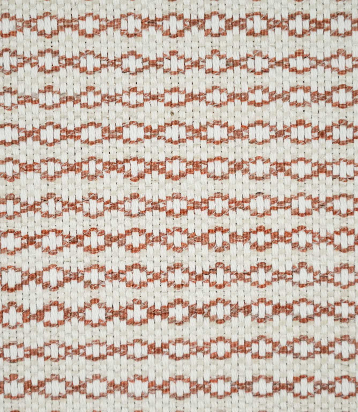 Close-up of Elkstone Terracotta upholstery fabric featuring a textured natural cream weave with repeating terracotta geometric motifs arranged in narrow horizontal rows.