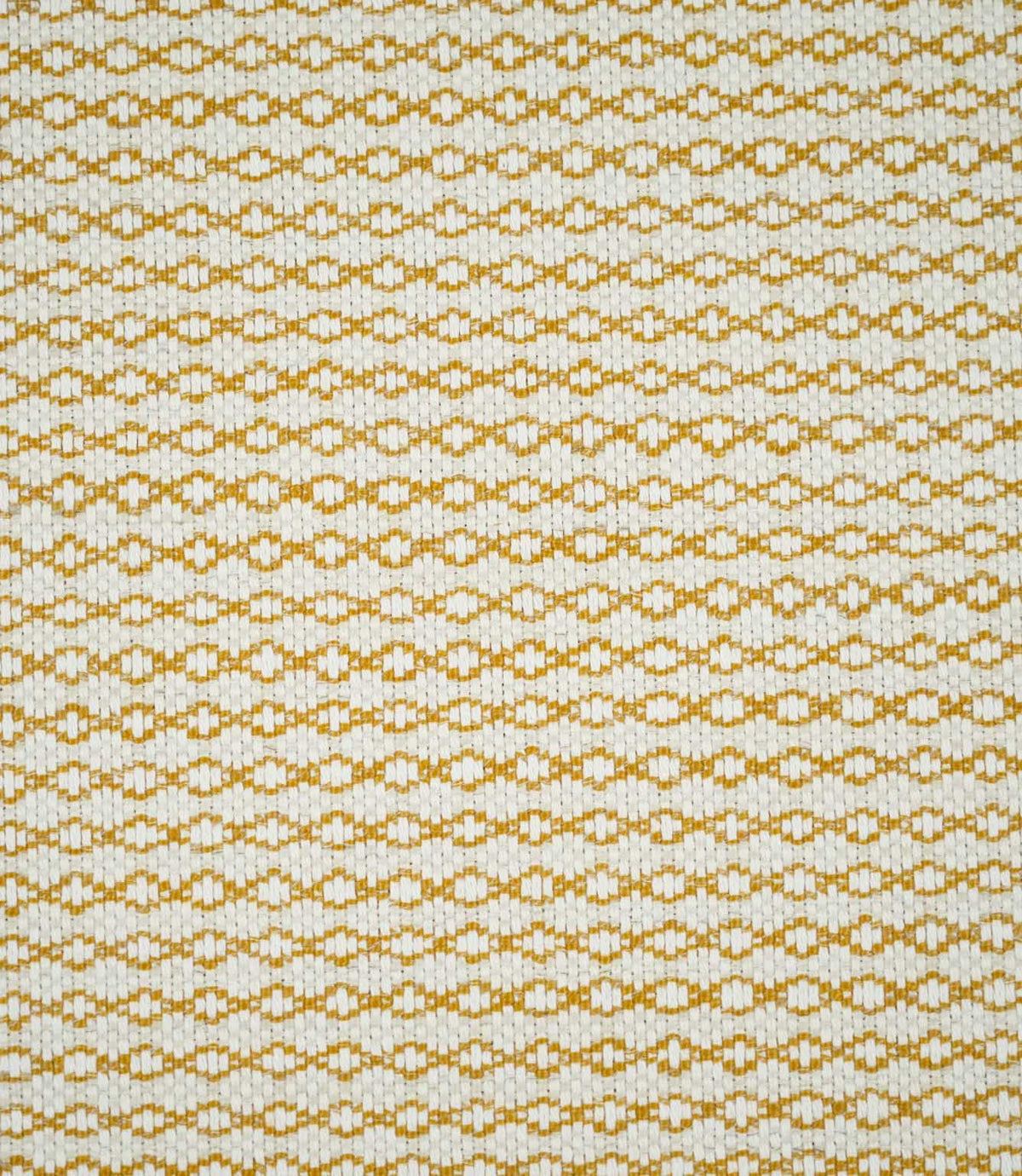 Full view of Elkstone Turmeric woven fabric showing a small-scale geometric pattern of interlocking golden yellow shapes across a natural cream background.