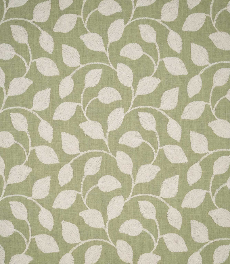 Ellerton Apple embroidered fabric featuring a flowing cream foliage design with softly curved stems and rounded leaves across a fresh apple green woven background, shown flat to clearly display the repeating contemporary botanical pattern.