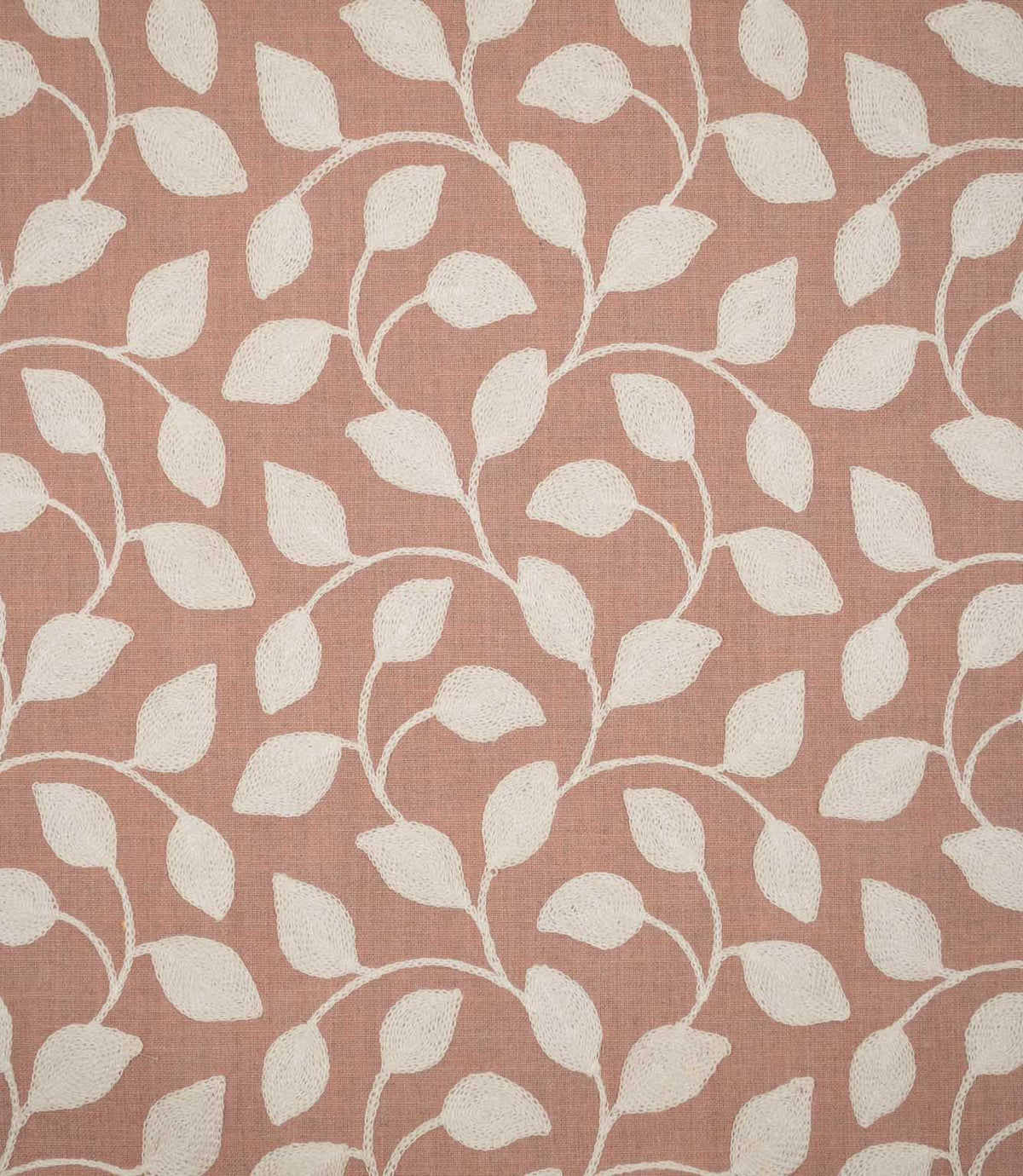 Ellerton Blush embroidered fabric featuring a flowing cream botanical leaf design with gently curving stems and rounded leaves across a soft blush pink woven background, shown flat to clearly display the full repeating foliage pattern and textured embroidery.
