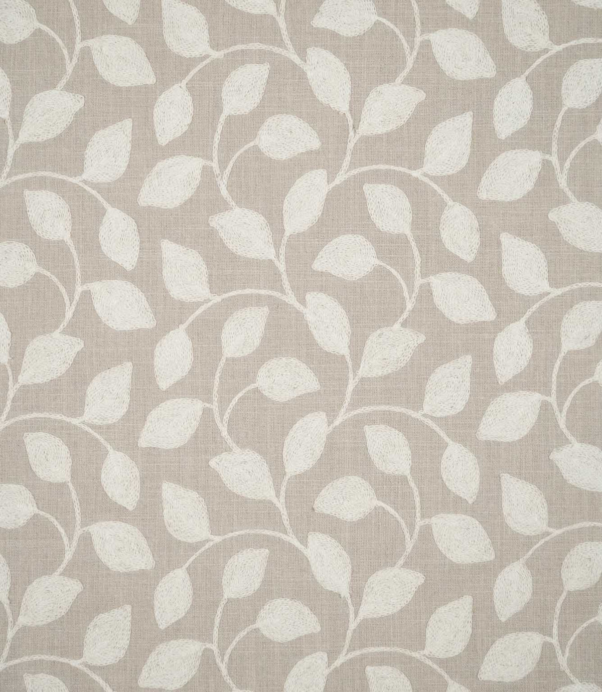 Ellerton embroidered foliage fabric featuring a repeating design of cream leaves and gently curving stems across a natural beige woven background, shown flat to display the full botanical pattern.