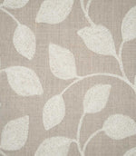 Close-up of Ellerton fabric showing raised cream embroidered leaves connected by delicate trailing stems on a natural beige woven ground, highlighting the detailed stitching and textured finish.