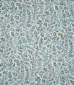 Elmsley blue sustainable fabric shown flat, featuring a small-scale floral and scrolling foliage pattern in soft blue, aqua and navy tones on a natural cream ground.
