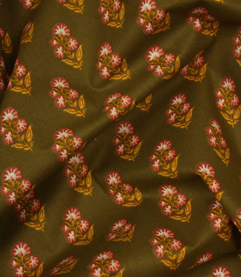 Draped olive botanical fabric with small pink and cream flower motifs and ochre leaf detailing.