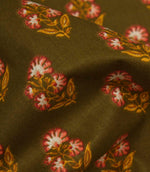 Close-up of olive floral fabric showing the textured weave and delicate repeating botanical pattern.