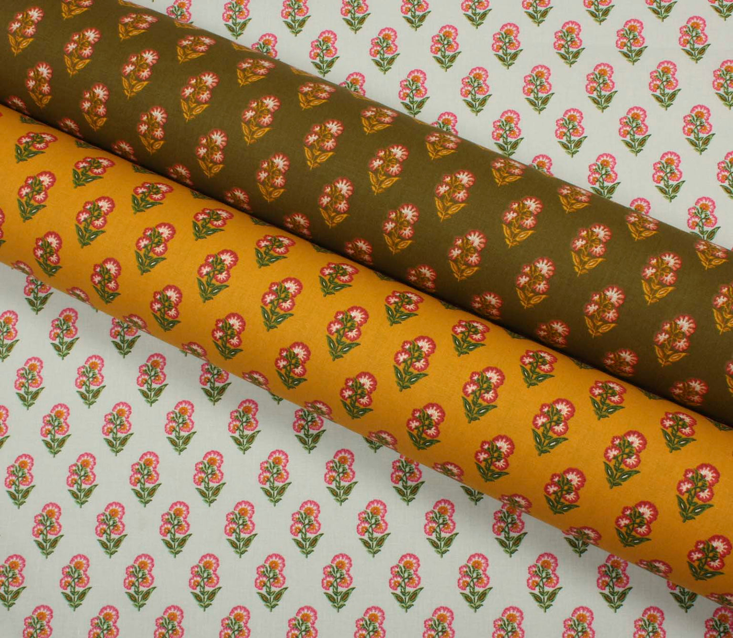 Three coordinating floral print fabrics displayed together, featuring repeating pink flower motifs on ivory, mustard yellow, and olive green backgrounds.