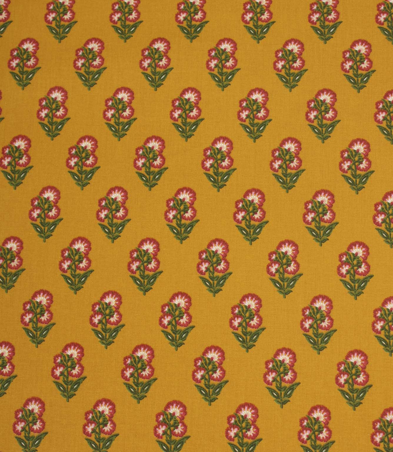 Mustard yellow fabric featuring a repeating floral sprig pattern with pink and white blooms and green foliage.