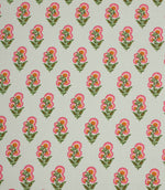 Delicate floral print fabric featuring small pink and orange blooms with green foliage on a soft ivory background.