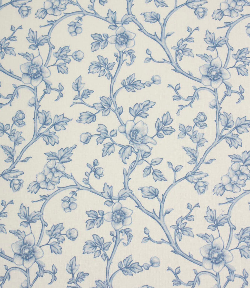 Blue floral fabric with a delicate trailing vine design on an ivory background, featuring soft blue flowers, leaves, and buds.