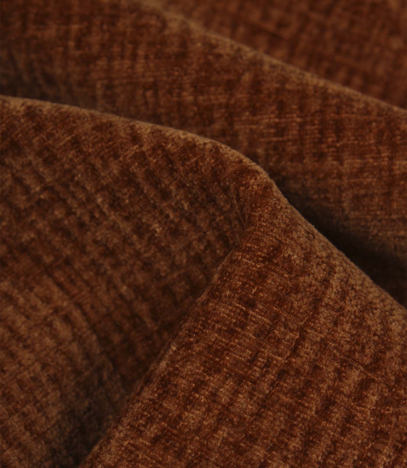 Detailed close-up of Everleigh Copper plain upholstery fabric showing the soft velour-style pile and textured copper surface.