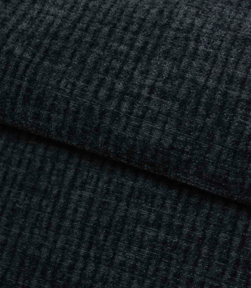 Folded Everleigh Denim plain upholstery fabric displaying its luxurious velour-inspired finish and textured denim blue appearance.