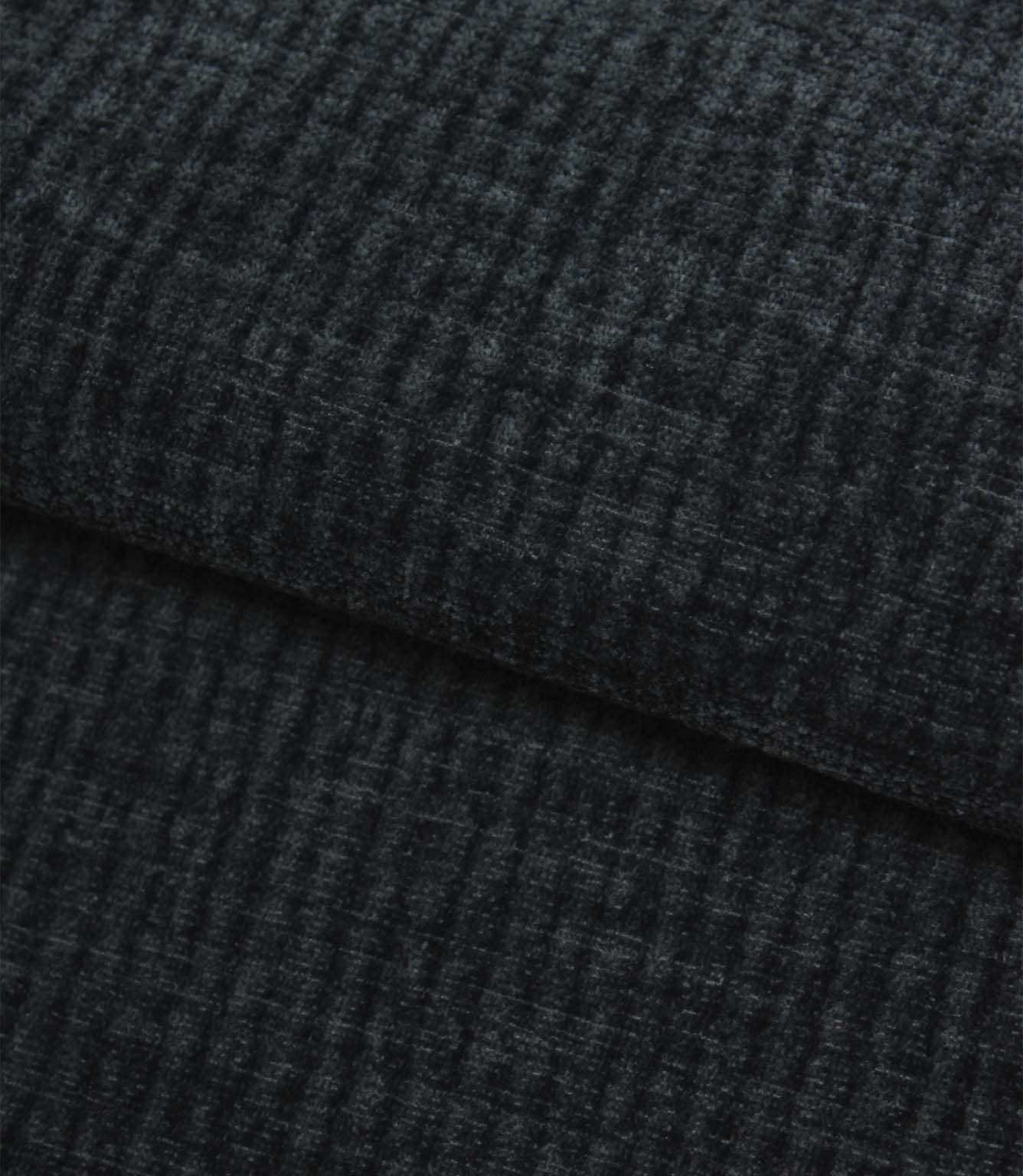 Folded Everleigh Denim plain upholstery fabric displaying its luxurious velour-inspired finish and textured denim blue appearance.