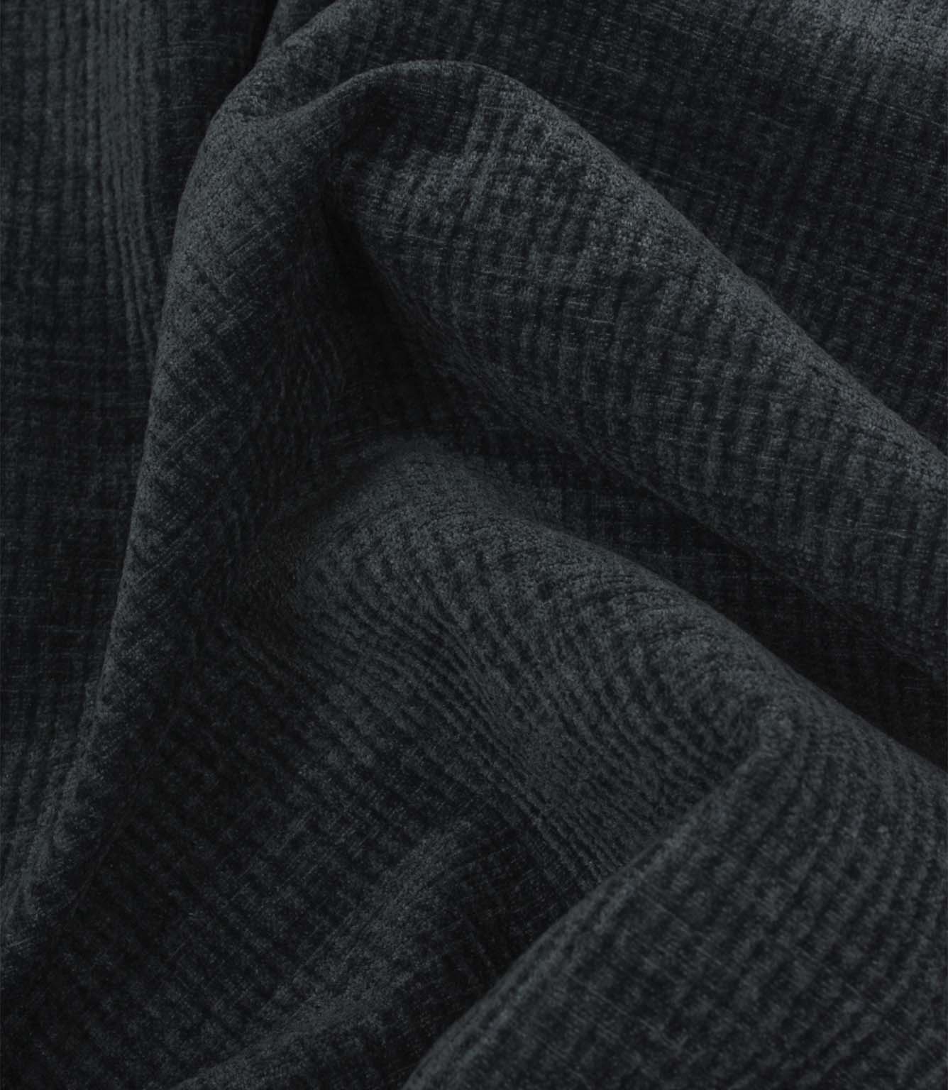 Draped Everleigh Denim upholstery fabric showing the soft handle, elegant movement and richly textured woven surface in a classic denim blue shade.