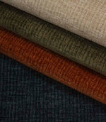 Everleigh upholstery fabric collection featuring Copper, Olive, Natural and Navy colourways with a textured plain velvet-look finish.
