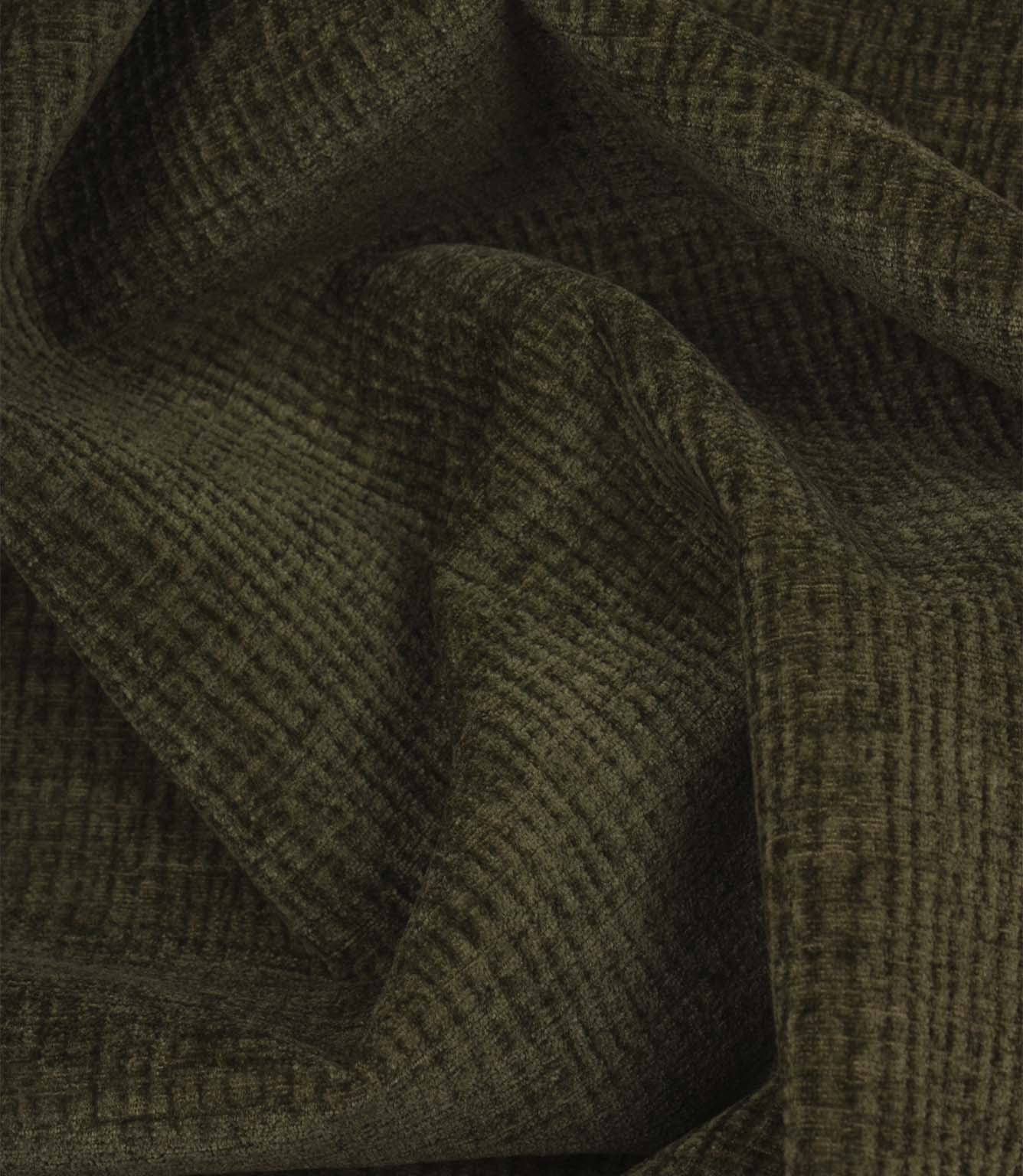 Draped Everleigh Moss upholstery fabric showing the soft handle, elegant movement and richly textured woven surface in a warm moss green shade.